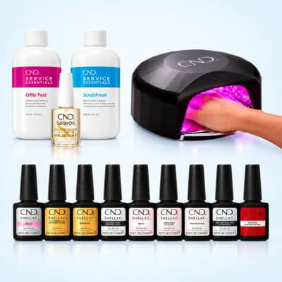 gel polish bottles and lamp with hand
